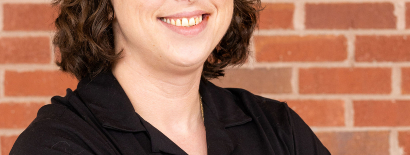 Alyssa Trifone, NorthPoint Pets team member, smiling in the store